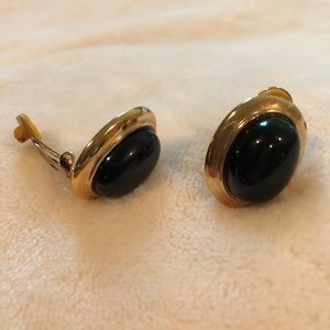 Gold toned and black clip on earrings